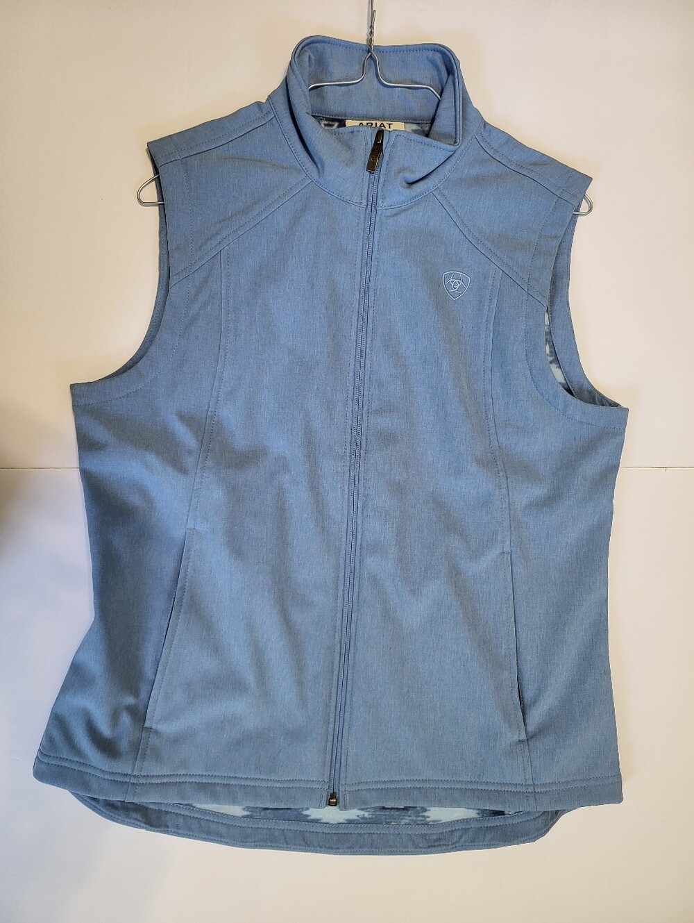 Women's light blue Ariat vest with interior concealed, carry pocket